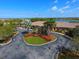 Aerial view of community clubhouse with landscaping and parking at 7914 Grand Estuary Trl # 102, Bradenton, FL 34212