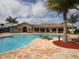 Relaxing community pool with lounge chairs at 7914 Grand Estuary Trl # 102, Bradenton, FL 34212