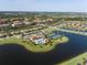 Aerial view of community, showing homes, lakes, and landscaping at 7914 Grand Estuary Trl # 102, Bradenton, FL 34212