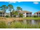 Back exterior view of condo with pond view at 7914 Grand Estuary Trl # 102, Bradenton, FL 34212