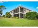 Back exterior view showing a two story building with a screened in porch at 7914 Grand Estuary Trl # 102, Bradenton, FL 34212