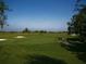 Green golf course with sand traps and lush landscape at 7914 Grand Estuary Trl # 102, Bradenton, FL 34212