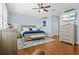 Main bedroom with wood floors and large windows at 7914 Grand Estuary Trl # 102, Bradenton, FL 34212