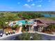 Large resort-style pool with surrounding lounge chairs at 7914 Grand Estuary Trl # 102, Bradenton, FL 34212