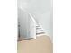 Modern staircase with dark wood steps and white risers at 7914 Grand Estuary Trl # 102, Bradenton, FL 34212