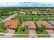 Aerial view of houses in a community by a canal at 11192 Whimbrel Ln, Sarasota, FL 34238