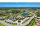 Community overview featuring a clubhouse, pool, and tennis courts at 11192 Whimbrel Ln, Sarasota, FL 34238