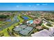 Community boasts resort-style pool, tennis courts, and scenic waterways at 11192 Whimbrel Ln, Sarasota, FL 34238