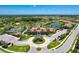 Community overview showcasing clubhouse, pool, and tennis courts at 11192 Whimbrel Ln, Sarasota, FL 34238