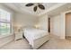 Guest bedroom with ceiling fan and neutral decor at 11192 Whimbrel Ln, Sarasota, FL 34238