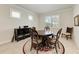 Elegant dining room with a round table and four chairs at 11192 Whimbrel Ln, Sarasota, FL 34238
