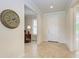 Bright entryway with tile flooring and a view of an adjacent sitting area at 11192 Whimbrel Ln, Sarasota, FL 34238