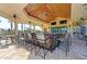 Indoor bar with seating and a tiled countertop at 11192 Whimbrel Ln, Sarasota, FL 34238
