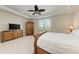 Spacious main bedroom with a large bed, dresser, and wardrobe at 11192 Whimbrel Ln, Sarasota, FL 34238