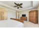 Main bedroom with a king-size bed and built in wardrobe at 11192 Whimbrel Ln, Sarasota, FL 34238