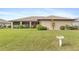 Spacious backyard with grassy lawn and bird bath at 1478 Navigator Rd, Punta Gorda, FL 33983