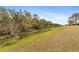 Peaceful backyard with canal view and lush landscaping at 1478 Navigator Rd, Punta Gorda, FL 33983