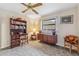 Bedroom with carpeted floor, built-in shelving, and ceiling fan at 1478 Navigator Rd, Punta Gorda, FL 33983