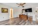 Bedroom with wood-look floors, dresser, and TV at 1478 Navigator Rd, Punta Gorda, FL 33983