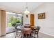 Bright dining area with round table and chairs, view to backyard patio at 1478 Navigator Rd, Punta Gorda, FL 33983