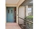 Light teal front door with sidelights and a screened porch at 1478 Navigator Rd, Punta Gorda, FL 33983