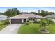 Front exterior view of charming one-story home at 1478 Navigator Rd, Punta Gorda, FL 33983