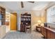 Bright home office features built-in shelving, desk, and comfortable chair at 1478 Navigator Rd, Punta Gorda, FL 33983
