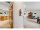 View of kitchen and living room with hardwood floors at 1478 Navigator Rd, Punta Gorda, FL 33983