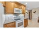 Bright kitchen with granite countertops, white appliances, and light wood cabinets at 1478 Navigator Rd, Punta Gorda, FL 33983