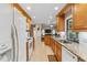 Long kitchen with granite counters and stainless steel appliances at 1478 Navigator Rd, Punta Gorda, FL 33983