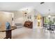 Open living and dining area with tile flooring and large windows at 1478 Navigator Rd, Punta Gorda, FL 33983