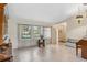 Living room with tiled floors, piano, and access to entryway at 1478 Navigator Rd, Punta Gorda, FL 33983