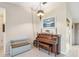 Living area with piano, light walls, and tiled floors at 1478 Navigator Rd, Punta Gorda, FL 33983