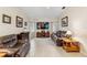 Spacious living room with vaulted ceiling, leather furniture, and large TV at 1478 Navigator Rd, Punta Gorda, FL 33983