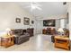 Living room features a vaulted ceiling, leather furniture, and a large TV at 1478 Navigator Rd, Punta Gorda, FL 33983