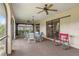 Relaxing screened porch with seating area and ceiling fans at 1478 Navigator Rd, Punta Gorda, FL 33983
