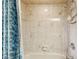 Clean shower with beige tile and floral accents at 1478 Navigator Rd, Punta Gorda, FL 33983