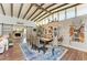 Bright dining room featuring a rustic wooden table and decorative shelving at 405 48Th Nw St, Bradenton, FL 34209