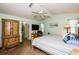 Main bedroom with a king-size bed and access to a sunroom at 4872 Limetree Ln, Venice, FL 34293