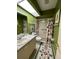 Clean bathroom with shower/tub combo and updated vanity at 919 Sunridge Dr # 919, Sarasota, FL 34234