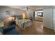 Cozy bedroom with a comfortable bed, built-in shelving, and en-suite bathroom at 919 Sunridge Dr # 919, Sarasota, FL 34234