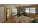 Bedroom with a queen-size bed, access to a sunroom and en-suite bathroom at 919 Sunridge Dr # 919, Sarasota, FL 34234