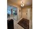 Bright entryway with tiled flooring and mirrored closet at 919 Sunridge Dr # 919, Sarasota, FL 34234