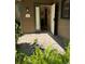 Front entry with tiled flooring, open door, and welcoming sign at 919 Sunridge Dr # 919, Sarasota, FL 34234