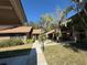 Exterior view showing a condo building with walkway and green space at 919 Sunridge Dr # 919, Sarasota, FL 34234