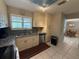 Kitchen with stainless steel appliances, granite counters, and view into dining area at 919 Sunridge Dr # 919, Sarasota, FL 34234