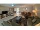 Living room features tiled floors, seating, and a view to the dining area at 919 Sunridge Dr # 919, Sarasota, FL 34234