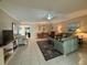 Spacious living room with tiled floors, comfortable seating, and dining area at 919 Sunridge Dr # 919, Sarasota, FL 34234