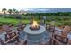 Community fire pit with seating, perfect for relaxing evenings at 12432 Golden Sage Dr, Sarasota, FL 34238