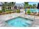 Community hot tub with tiled surround and comfortable seating at 12432 Golden Sage Dr, Sarasota, FL 34238